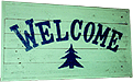 White and Blue Welcome Sign